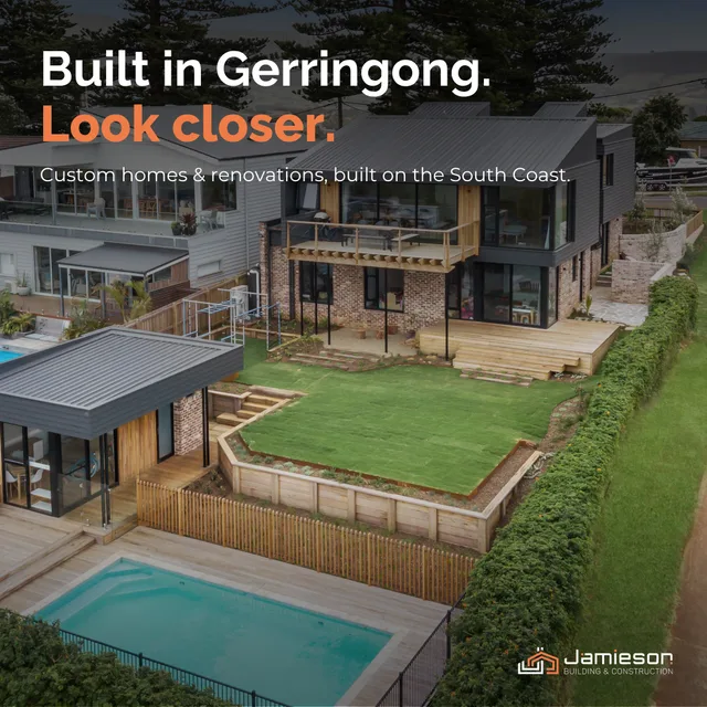 Aerial view of a finished two-storey home with a pool, lawn and timber decks. Card text: Built in Gerringong. Look closer.