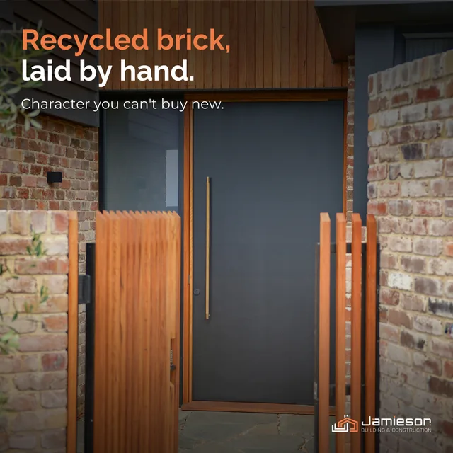 A front door framed by hand-laid recycled brick and timber screening. Card text: Recycled brick, laid by hand. Character you can't buy new.