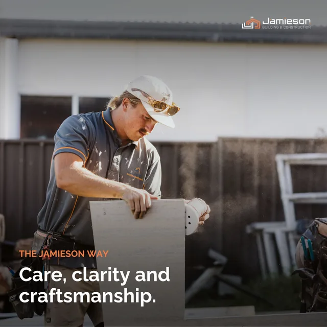 A builder measuring a cut piece of cladding. Card text: Care, clarity and craftsmanship.